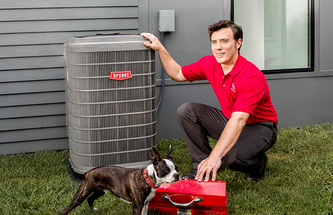 Bryant technician installing an A/C unit